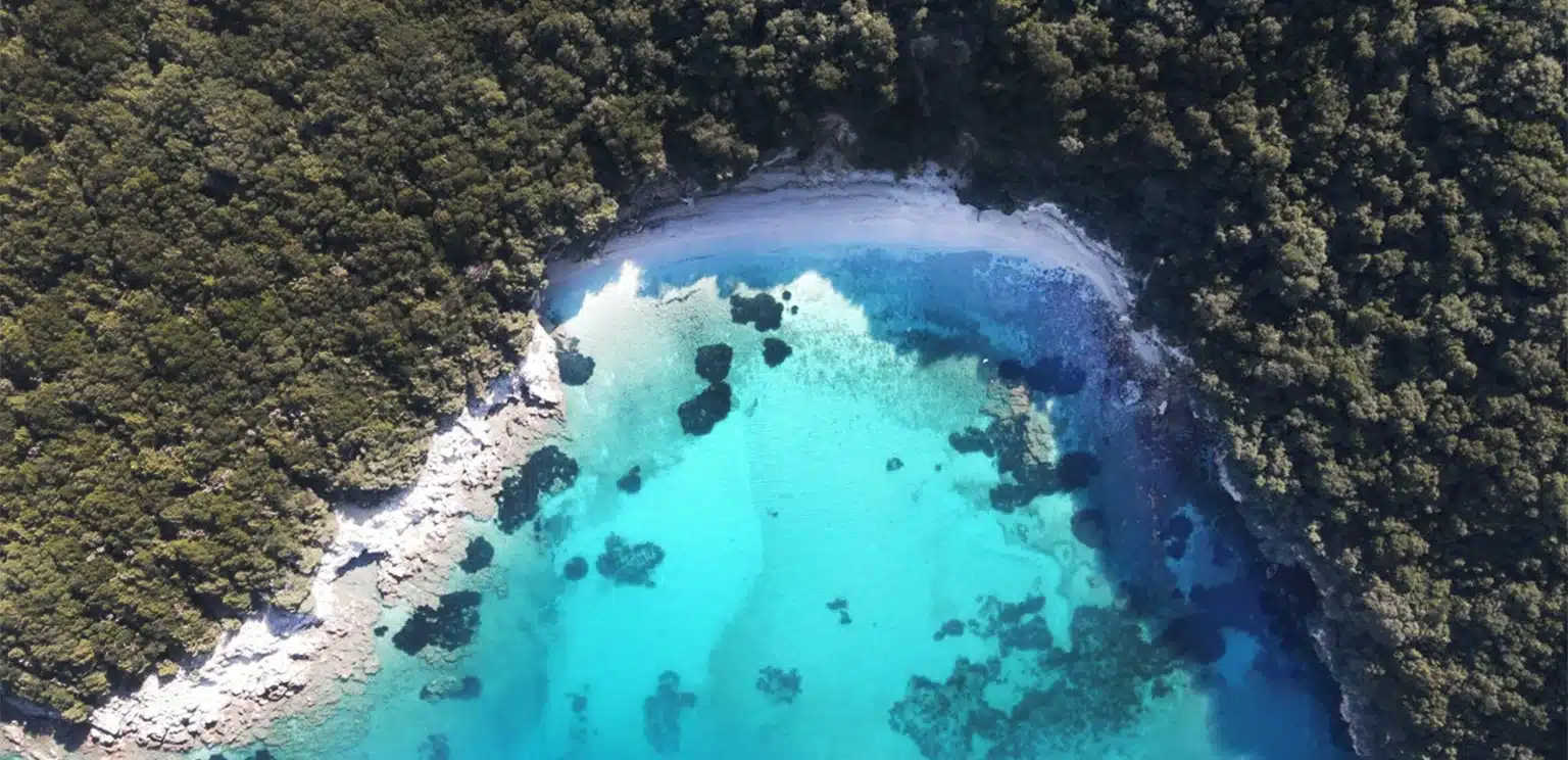 crystal clear blue water beach in sivota