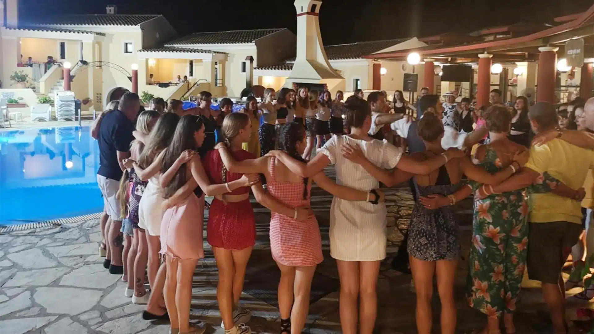 people dancing on a greek night at mediterranean blue hotel